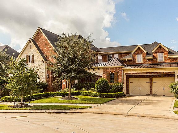 Brick and Stone elevation. Home built by David Weekley Homes