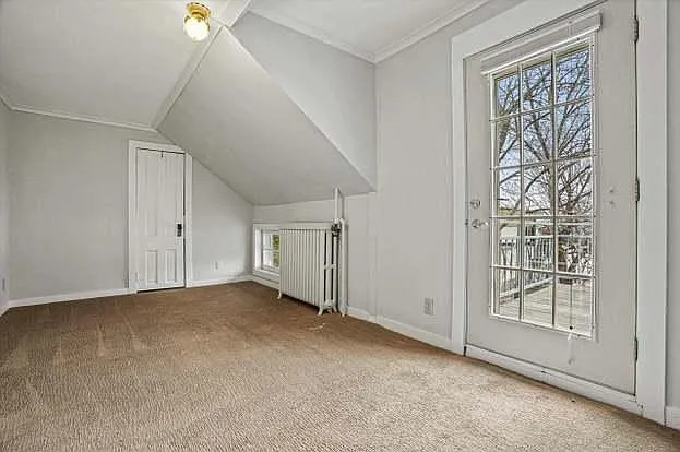 Second bedroom with lake-facing balcony