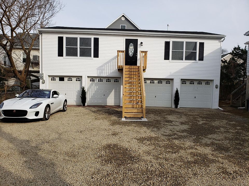Front of single family home .all new siding new windows new oval front steel door,new steps.
