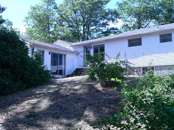 Back of house from path to shorline of Pond