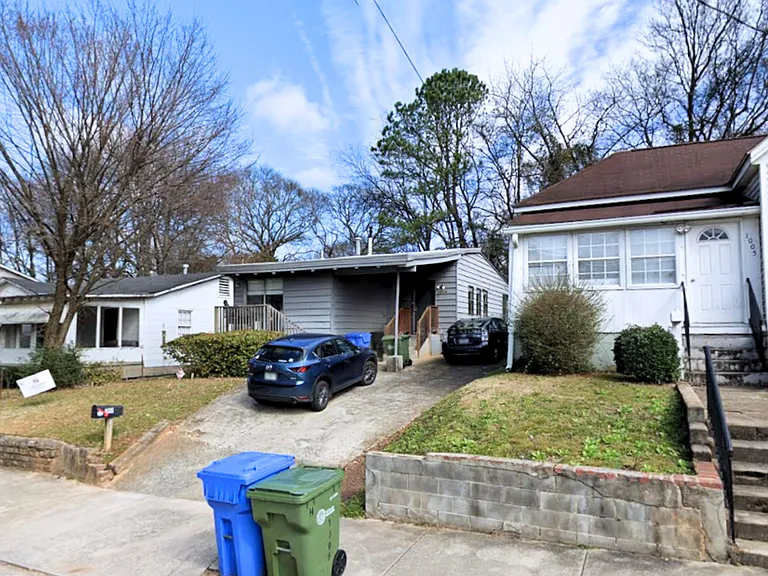 Grey House with Driveway parking for 2 or 3 cars