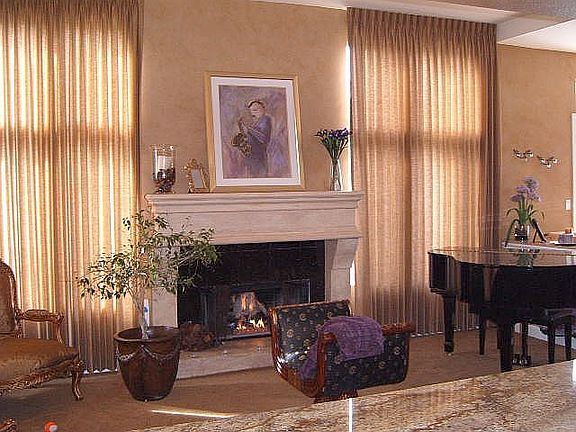 living room with stone fireplace