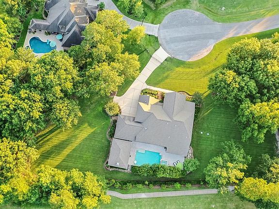 Just over an acre lot with full perimeter fence, sparkling pool & hot tub + a HUGE outdoor Pavilion space complete with kitchen & fireplace. No Flooding Here!