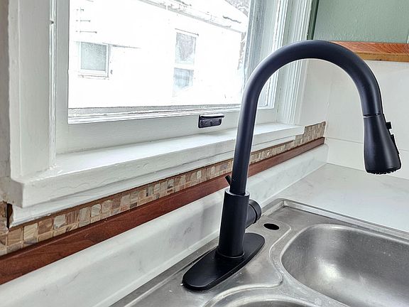 Updated countertop and faucet.