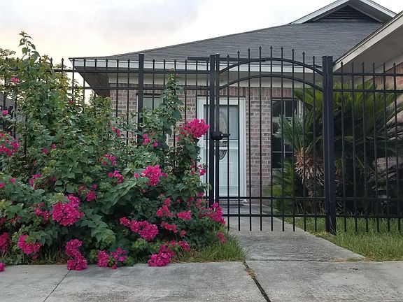 Main Entrance with security gate and beautiful flowers