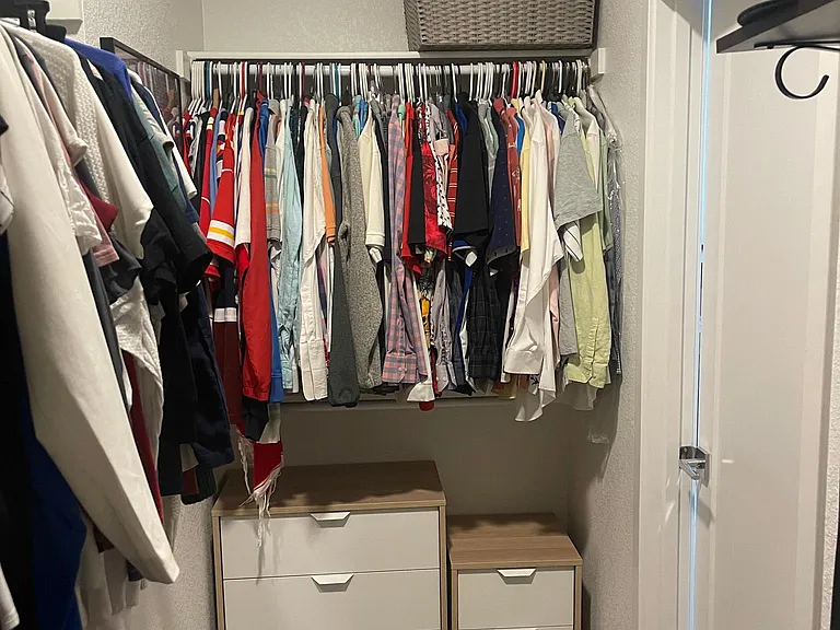 Primary bedroom walk in closet