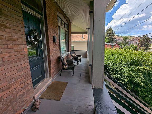 Front Porch offers great views of the city of Lead and the historic "Open Cut"