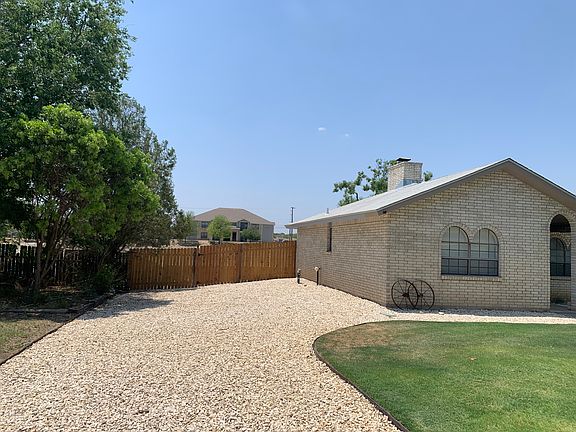 Left side of house (gate access)