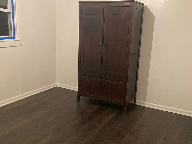 Nonconforming bedroom #3, with window and undetached wardrobe for clothing storage.