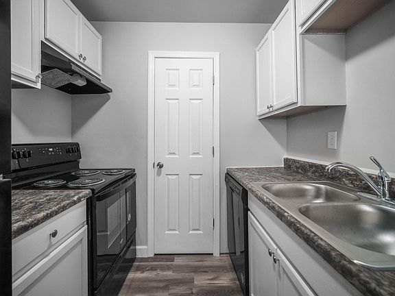 Kitchen with walk-in pantry.