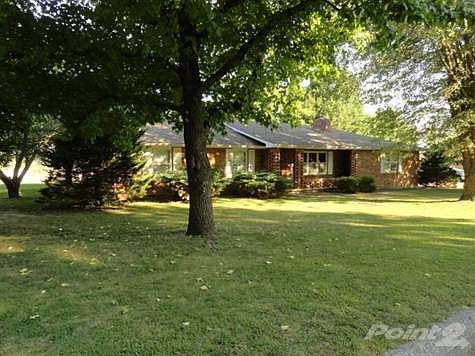 All brick home with 3BR/2BA, huge kitchen with dining area and large shade trees in front and back. Double car garage with workshop,