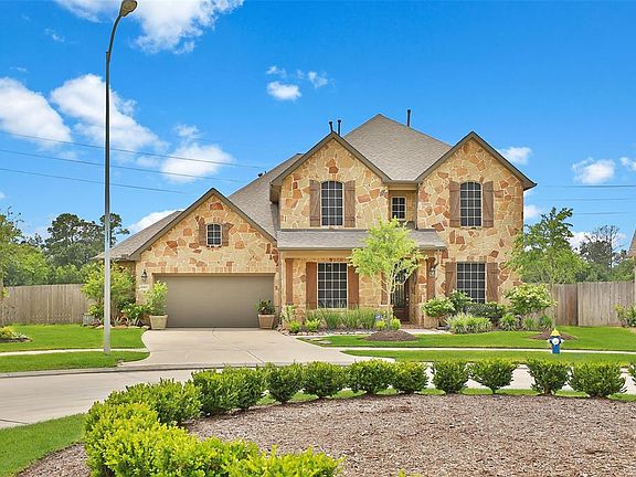 Stunning curb appeal with a stone elevation is inviting.