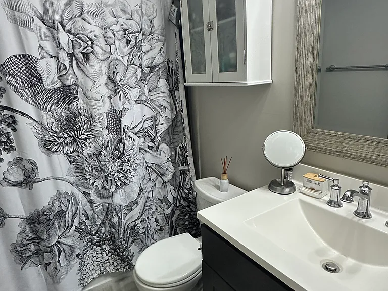 Bathroom with bathtub and tile surround