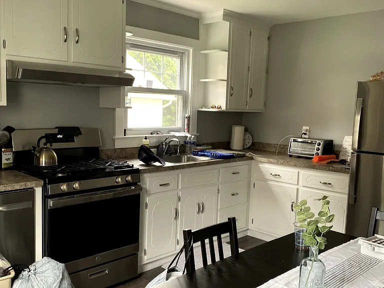 Kitchen has all stainless steel appliances.
