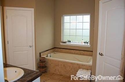 Master bathroom with 6' soaking tub, separate shower, double closets & sinks