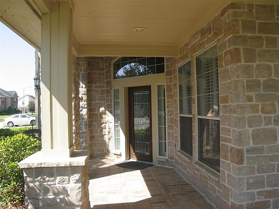 Closer view of 2 car carport. 2 car garage.