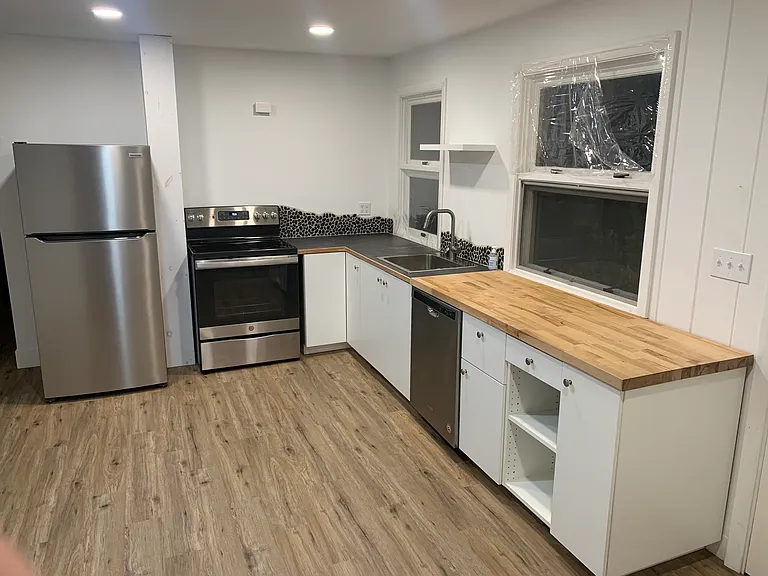 Fresh kitchen with new electric appliances.