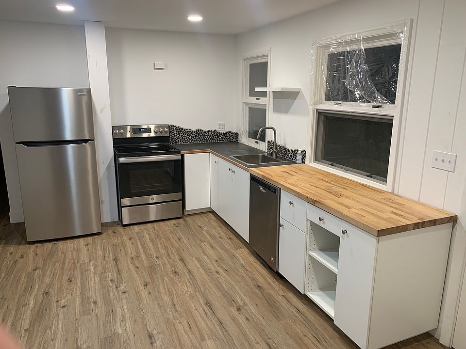 Fresh kitchen with new electric appliances.
