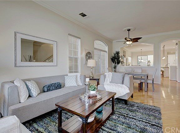 Formal Living room and Dining room with Designer Ceiling fan.