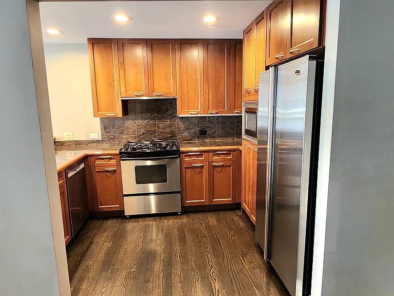View of the kitchen from near the bedroom door.