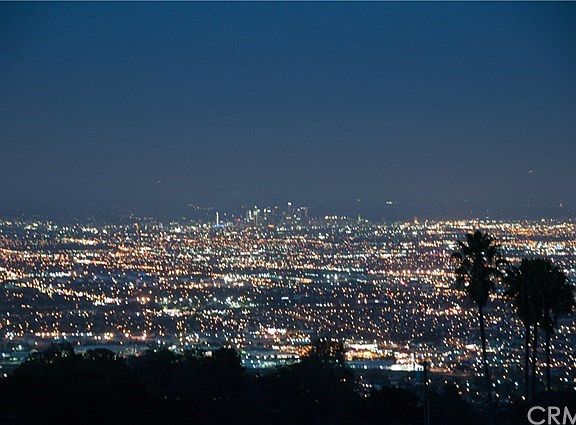 The panoramic and breathtaking night time views include the downtown skyscrapers.