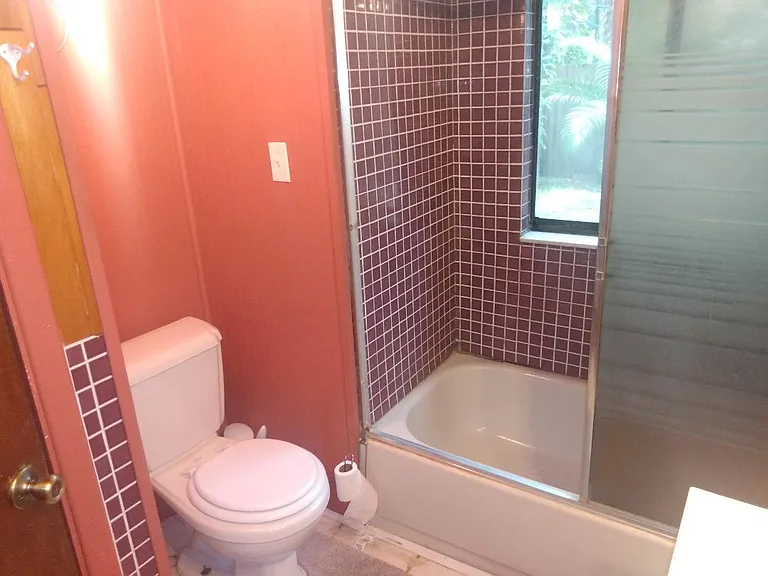 condo toilet and tub shower