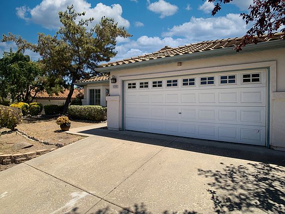 Two car garage with aluminum door.
