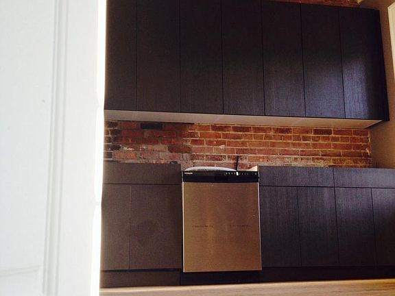 kitchen with custom cabinets and stainless steel appliances