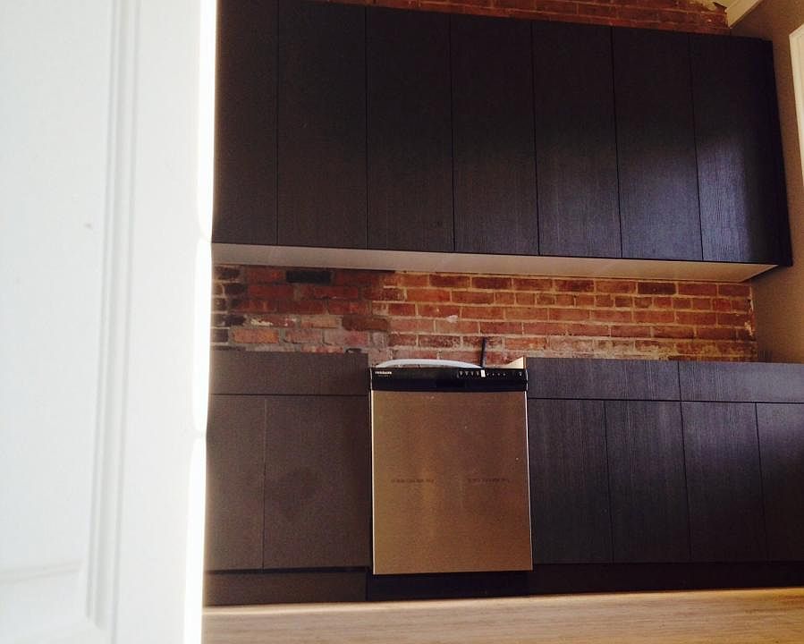 kitchen with custom cabinets and stainless steel appliances