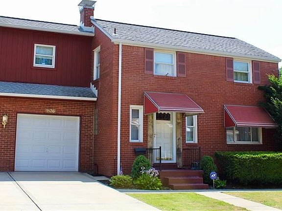 A cozy, all-brick colonial on a one way street near everything in the city.