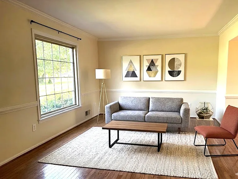 1st Floor - Living room with hardwood floors and decorative features