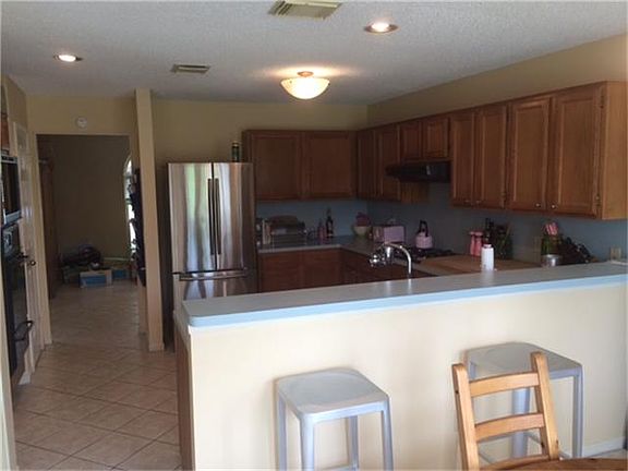 Coming back in from the back yard, you enter the Kitchen. It is open and lots of room for cooking as