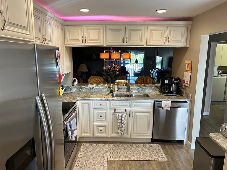 Updated kitchen with stainless steel appliances.