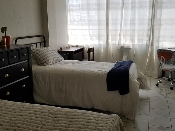 Bedroom showing both beds etc.