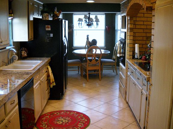 Galley kitchen with granite countertops