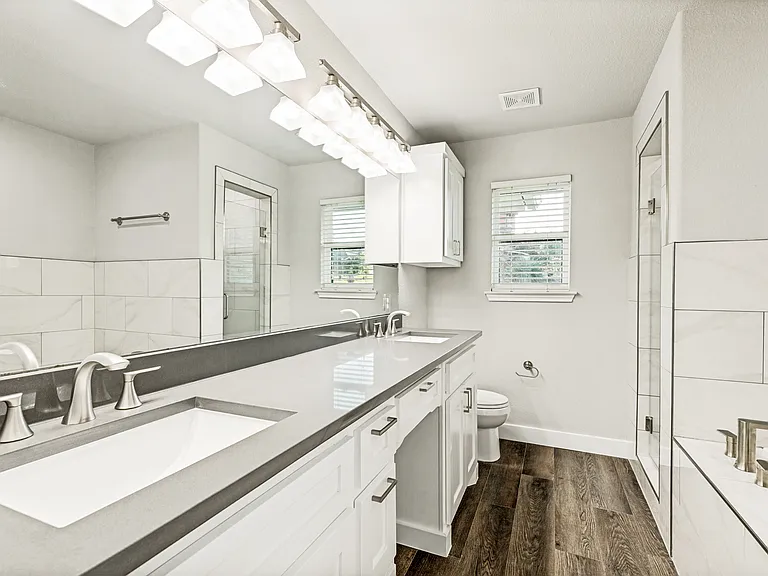 Ensuite primary bathroom featuring large garden soaking tub and separate shower!