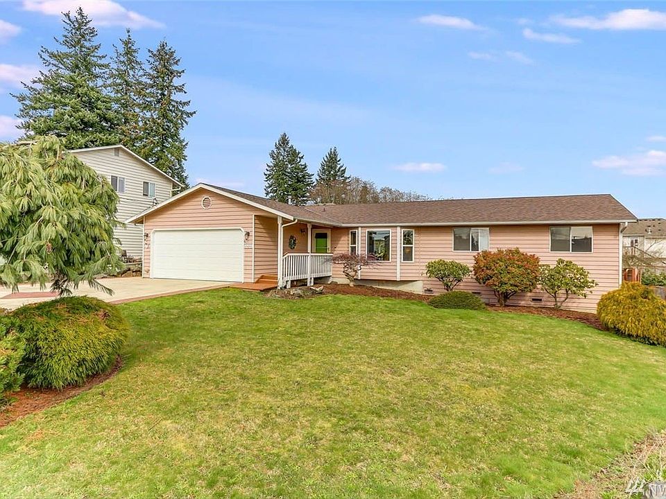 Welcome home to this beautifully cared for rambler on a quite cul-de-sac. Luxury vinyl plank throughout this amazing home. Two living areas, one with a large bay window and the other with a cozy wood burning fireplace. Skylights bring in loads of natural light to kitchen and living room. 3 nice sized bedrooms including a master with slider to deck. Extend your living space outdoors to the wonderful covered deck and amazing stamped concrete patio. Nice sized fully fenced back yard with mature landscaping and storage shed. Updates include alarm system, new appliances in 2017, A/C installed in 2018 and a brand new roof installed just one week ago! Commuters dream with easy access to Martha Lake, McCollum park, recreations trails & I-5