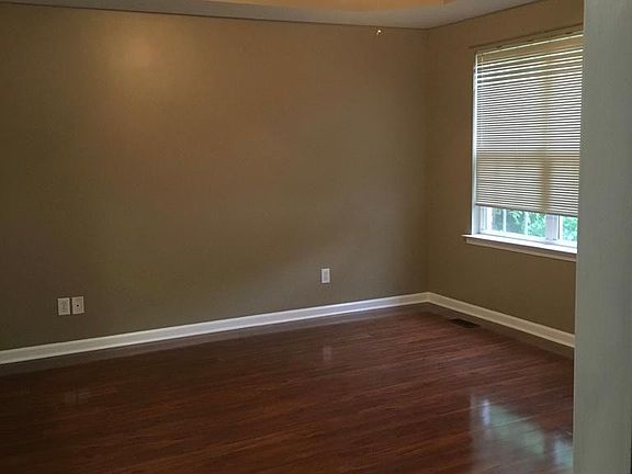 Beautiful tray ceiling with ceiling fan.
Benjamin Moore Stone Lion is neutral while the white trim really pops!