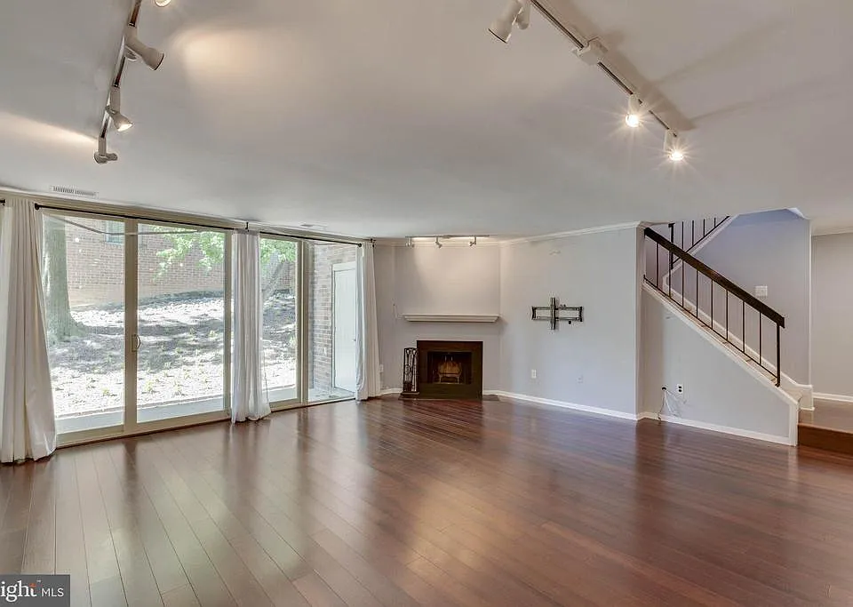Wide OPEN living room area w/ fireplace