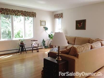 Great room with large window overlooking back yard