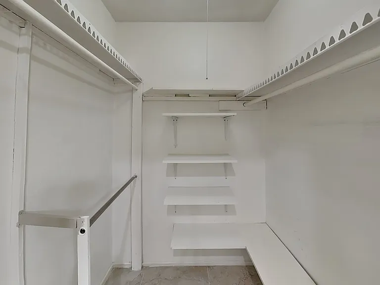This white storage room featur
