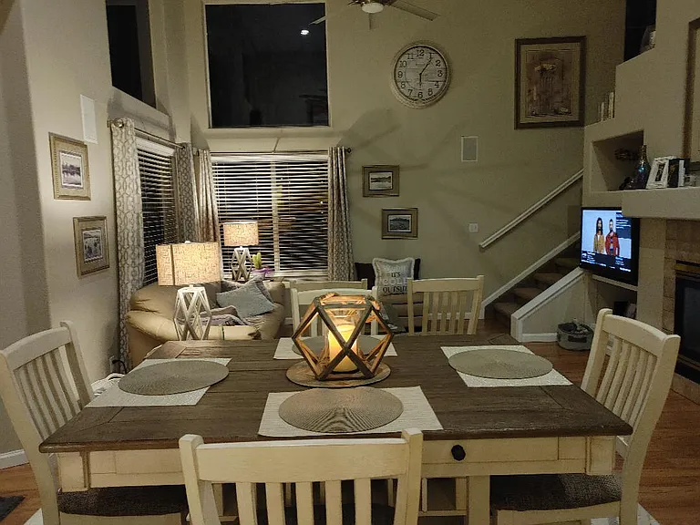 Fully furnished neutral decor fireplace in living area, sliding door to large deck with open space , large private lot
