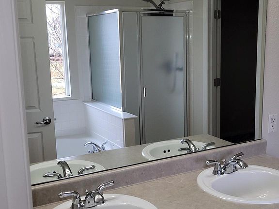 Garden Tub, 2 sinks and lots of light in the Primary Bedroom