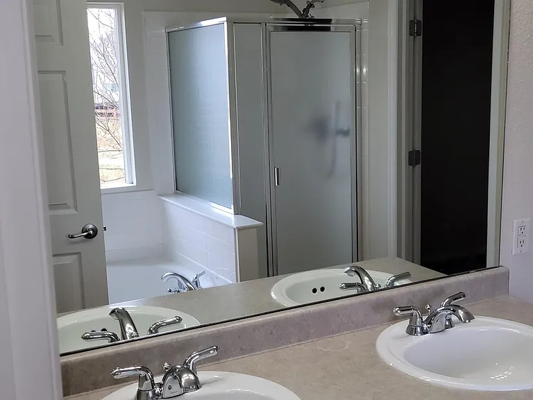 Garden Tub, 2 sinks and lots of light in the Primary Bedroom