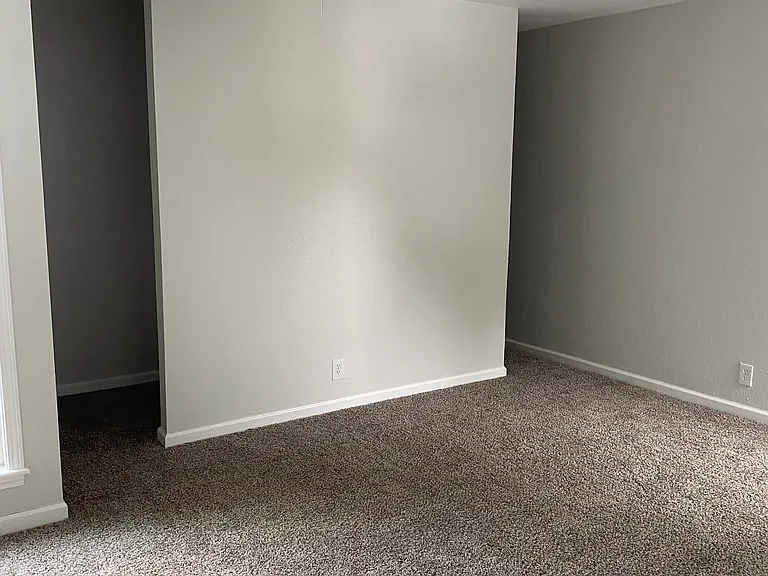 Walk through closet behind the wall.