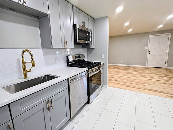 The kitchen and living area blend seamlessly, ideal for hosting guests