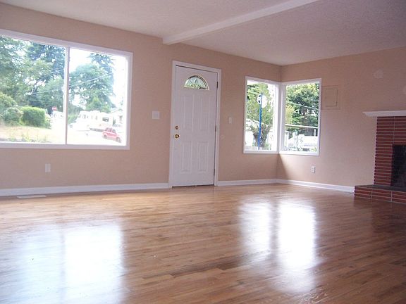 Looking towards the front door to fireplace.