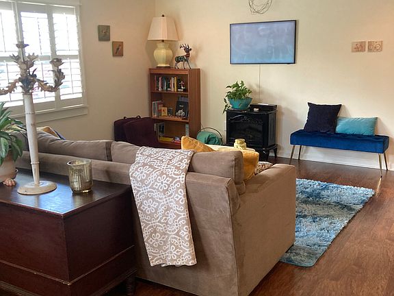 Living Room with Art TV and fake fireplace for ambiance.