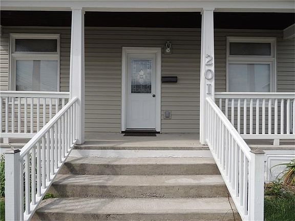 This beautiful entry door will greet your guests.  There plenty of room for everyone on the spacious front porch.