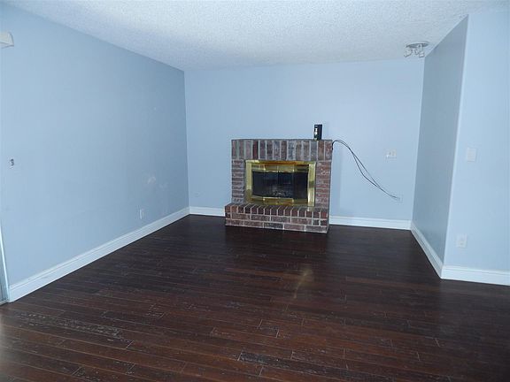 Cozy family room with  brink fireplace